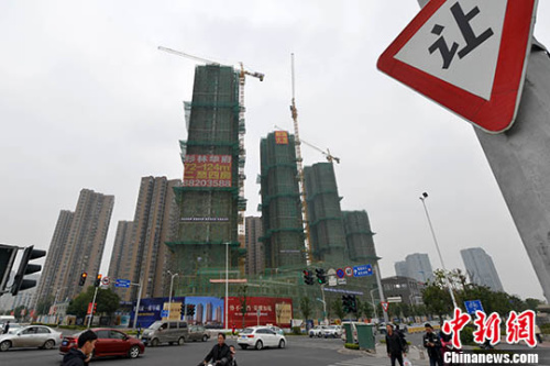 资料图:商品房建设。 中新社记者 吕明 摄